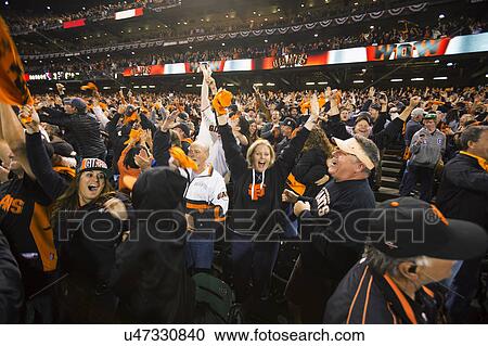 Stock Image - San Francisco, California, USA, October 16, 2014, AT&T Park, baseball stadium, SF Giants versus St. Louis Cardinals, National League Championship Series (NLCS), excited crowd Giants win 2014 NL Pennant. Fotosearch