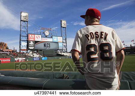 Stock Image - San Francisco, California, USA, October 16, 2014, AT&T Park, baseball stadium, SF Giants versus St. Louis Cardinals, National League Championship Series (NLCS), fan with Posey #28 uniform pre-game. Fotosearch
