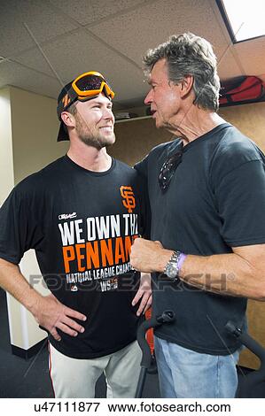 Stock Photo - San Francisco, California, USA, October 16, 2014, AT&T Park, baseball stadium, SF Giants versus St. Louis Cardinals, National League Championship Series (NLCS), Hunter Strickland (left) speaks to Uncle Bill Terry. Fotosearch