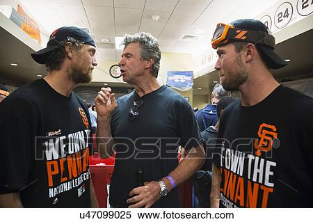Stock Photography - San Francisco, California, USA, October 16, 2014, AT&T Park, baseball stadium, SF Giants versus St. Louis Cardinals, National League Championship Series (NLCS), Bill Terry speaks with Hunter Pence and Hunter Strickland. Fotosearch