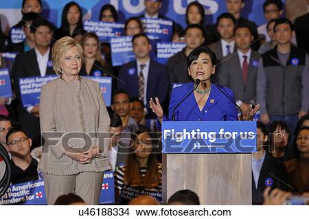 Picture - SAN GABRIEL, LA, CA - JANUARY 7, 2016, Democratic Presidential candidate Hillary Clinton stairs at crowd at Asian American and Pacific Islander (AAPI) members, while Democrat Representative Judy Chu speaks at podium.. Fotosearch