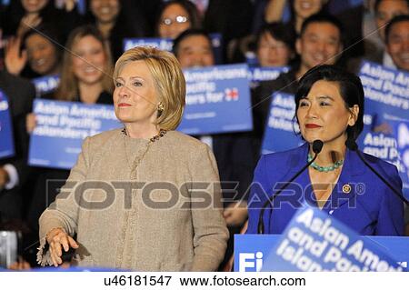 Stock Photo - SAN GABRIEL, LA, CA - JANUARY 7, 2016, Democratic Presidential candidate Hillary Clinton stairs at crowd at Asian American and Pacific Islander (AAPI) members, while Democrat Representative Judy Chu speaks at podium.. Fotosearch