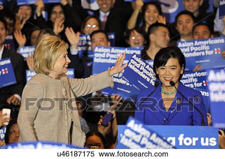 SAN GABRIEL, LA, CA - JANUARY 7, 2016, Democratic Presidential candidate Hillary Clinton stairs at crowd at Asian American and Pacific Islander (AAPI) members, while Democrat Representative Judy Chu speaks at podium. View Large Photo Image Stock Photography - SAN GABRIEL, LA, CA - JANUARY 7, 2016, Democratic Presidential candidate Hillary Clinton stairs at crowd at Asian American and Pacific Islander (AAPI) members, while Democrat Representative Judy Chu speaks at podium.. Fotosearch