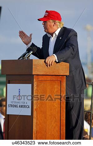 SAN PEDRO, CA - SEPTEMBER 15, 2015: Donald Trump, 2016 Republican presidential candidate, speaks during a rally aboard the Battleship USS Iowa in San Pedro, Los Angeles, California while wearing a red baseball hat that says campaign slogan "Make... View Large Photo Image Stock Image - SAN PEDRO, CA - SEPTEMBER 15, 2015: Donald Trump, 2016 Republican presidential candidate, speaks during a rally aboard the Battleship USS Iowa in San Pedro, Los Angeles, California while wearing a red baseball hat that says campaign slogan "Make.... Fotosearch