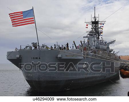Stock Photo - SAN PEDRO, CA - SEPTEMBER 15, 2015: US Flag flies on Battleship USS Iowa on display at the Port of Los Angeles, California USA. Fotosearch