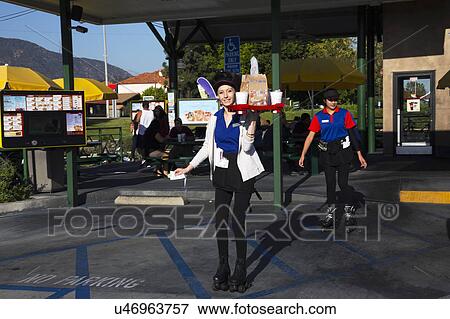 Southern California, USA, April 12, 2015, Car Hop, Waitress on rollerskates View Large Photo Image Stock Photo - Southern California, USA, April 12, 2015, Car Hop, Waitress on rollerskates. Fotosearch