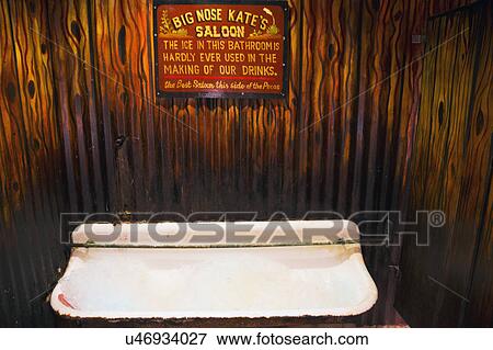 Stock Photo - Tombstone, Arizona, USA, April 6, 2015, men's urinal in old western town home of Doc Holliday and Wyatt Earp and Gunfight at the O. K. Corral. Fotosearch