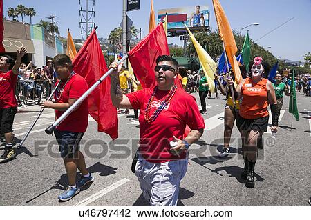Stock Image - West Hollywood, Los Angeles, California, USA, June 14, 2015, 40th annual Gay Pride Parade for LGBT Community, down Santa Monica Blvd., marchers in colorful shirts and flags. Fotosearch