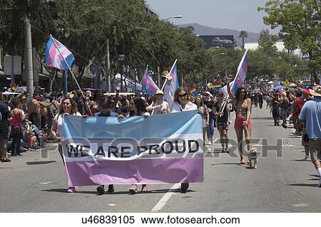 Stock Photography - West Hollywood, Los Angeles, California, USA, June 14, 2015, 40th annual Gay Pride Parade for LGBT Community, down Santa Monica Blvd., sign saying "We are Proud". Fotosearch