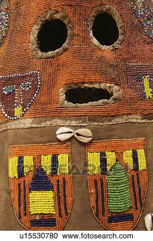 Stock Image - Beaded African mask detail. Fotosearch