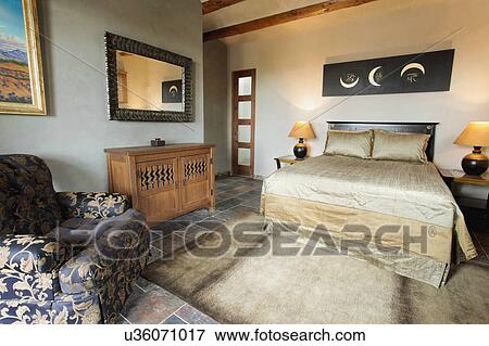 Bedroom in green and recycled home View Large Photo Image Stock Photo - Bedroom in green and recycled home. Fotosearch