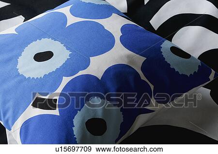 Stock Photo - Blue floral print throw pillow. Fotosearch