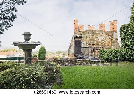 Stock Image - Bridge connecting yard to Historic Italian castle. Fotosearch