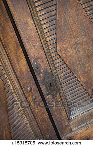 Carved wooden door with intricate keyhole View Large Photo Image Stock Photography - Carved wooden door with intricate keyhole. Fotosearch