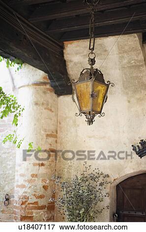 Chain hanging light outside entry View Large Photo Image Stock Photo - Chain hanging light outside entry. Fotosearch
