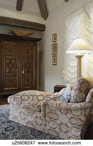Chaise lounge and lamp in bedroom View Large Photo Image Stock Photo - Chaise lounge and lamp in bedroom. Fotosearch