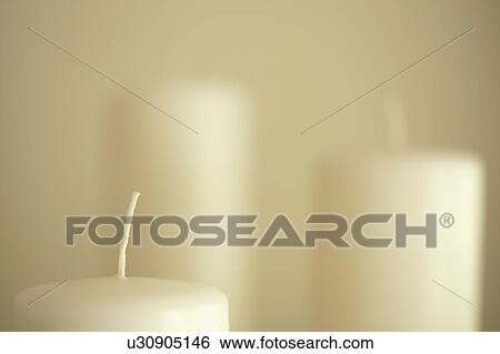 Close-up of white candles View Large Photo Image Stock Photograph - Close-up of white candles. Fotosearch