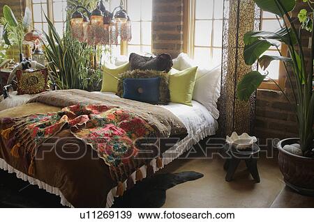 Colorful bed runner and throw pillows on bed View Large Photo Image Stock Photo - Colorful bed runner and throw pillows on bed. Fotosearch