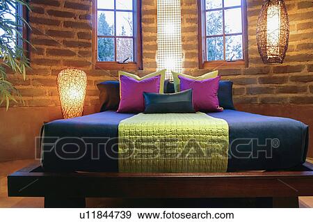 Stock Photo - Colorful bedding on bed. Fotosearch