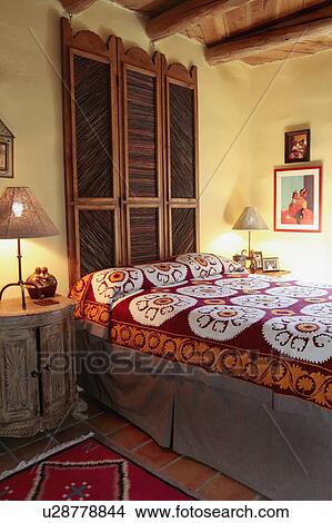 Picture - Colorful blanket on bed. Fotosearch