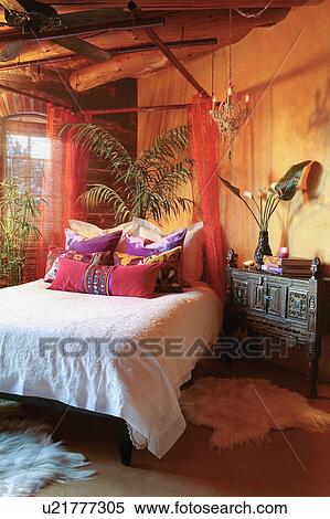 Stock Photography - Colorful throw pillows on bed. Fotosearch