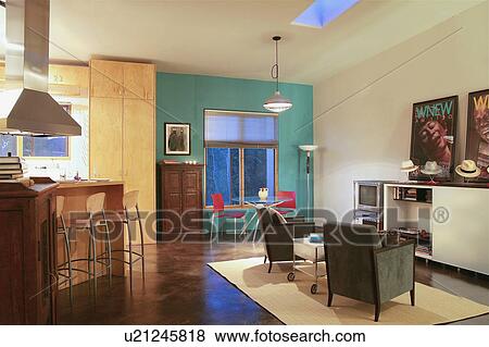 Contemporary kitchen and living room in loft apartment View Large Photo Image Stock Photo - Contemporary kitchen and living room in loft apartment. Fotosearch