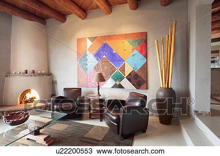 Stock Image - Contemporary southwestern living room with ceiling beams. Fotosearch