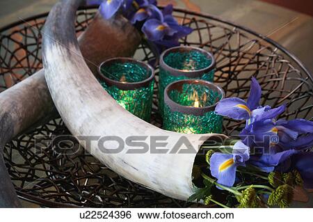 Stock Photograph - Decorative centerpiece with flowers and candles. Fotosearch