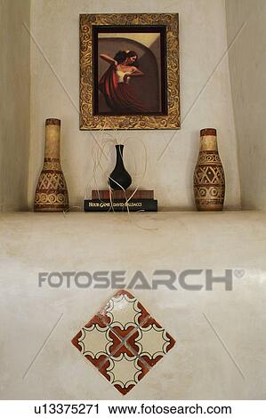 Stock Image - Decorative details on mantle. Fotosearch