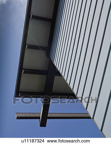 Picture - Detail blue sided house against blue sky. Fotosearch