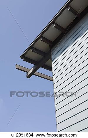 Detail blue sided house against blue sky View Large Photo Image Picture - Detail blue sided house against blue sky. Fotosearch