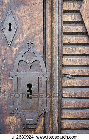 Picture - Detail intricate keyhole on wooden door. Fotosearch