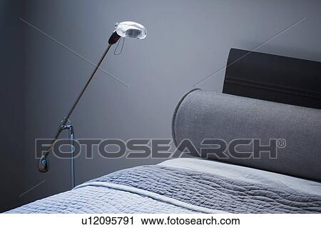Detail modern floor lamp beside bed View Large Photo Image Stock Image - Detail modern floor lamp beside bed. Fotosearch