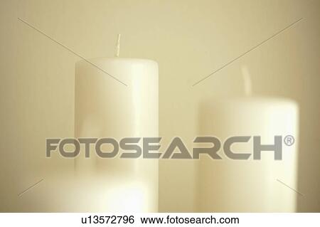 Detail set of white candles View Large Photo Image Stock Photograph - Detail set of white candles. Fotosearch