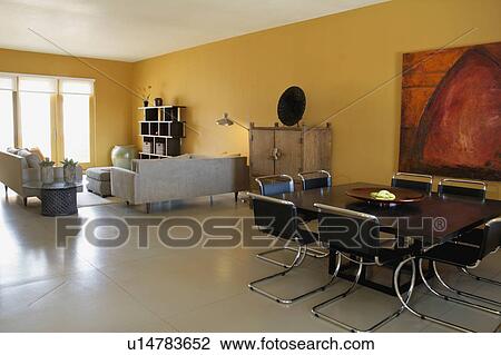 Stock Image - Dining room and living room in modern home. Fotosearch