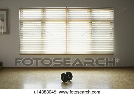 Dumbbell on wooden floor below window View Large Photo Image Stock Photography - Dumbbell on wooden floor below window. Fotosearch