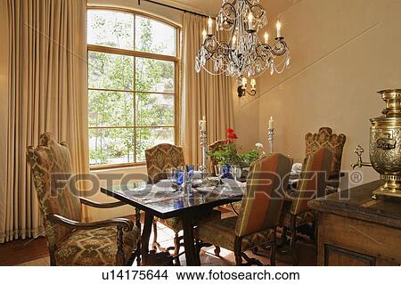 Elegant chandelier above dining room table View Large Photo Image Picture - Elegant chandelier above dining room table. Fotosearch