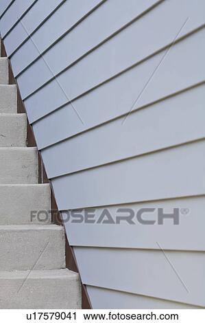 Stock Image - Exterior of home detail staircase and siding. Fotosearch