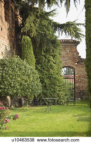 Grass yard alongside brick castle View Large Photo Image Stock Photo - Grass yard alongside brick castle. Fotosearch