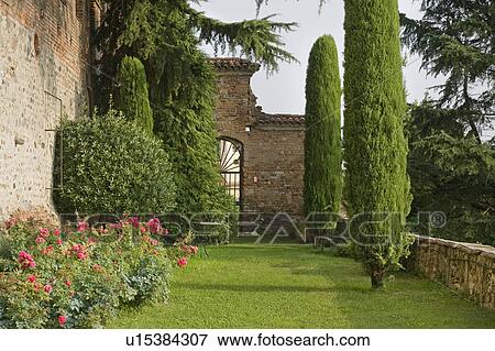 Grass yard alongside brick castle View Large Photo Image Stock Photo - Grass yard alongside brick castle. Fotosearch