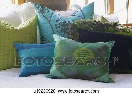 Stock Image - Green and blue throw pillows. Fotosearch