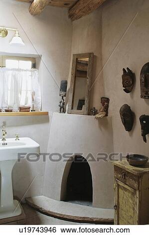 Stock Photograph - Guest bath with kiva fireplace. Fotosearch