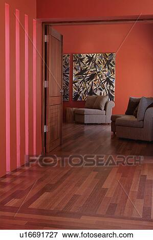Stock Photo - Hallway with hardwood floors and red walls. Fotosearch