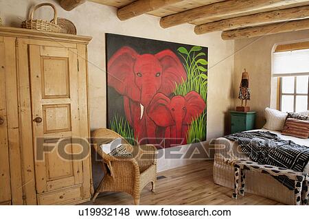 Stock Photo - Large painting of an elephant in artist's bedroom. Fotosearch