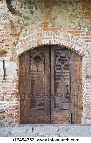 Stock Image - Large wooden double doors. Fotosearch