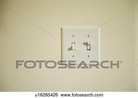 Neutral colored light switch on plain wall View Large Photo Image Stock Photograph - Neutral colored light switch on plain wall. Fotosearch