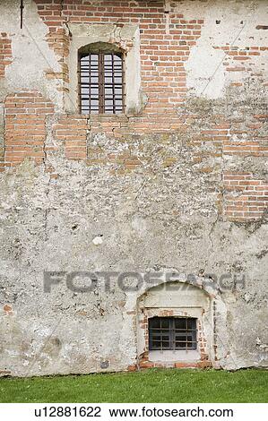 Stock Image - Old concrete and brick wall. Fotosearch