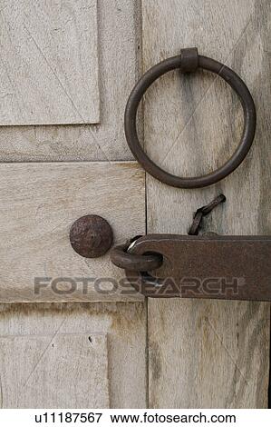 Old wooden door and iron detail View Large Photo Image Stock Photo - Old wooden door and iron detail. Fotosearch