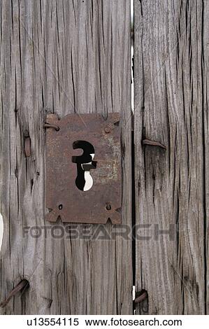 Old wooden door and iron detail View Large Photo Image Stock Photography - Old wooden door and iron detail. Fotosearch