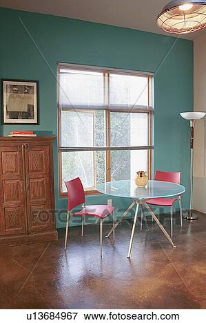 Stock Photo - Pink chairs and glass table in teal colored. Fotosearch
